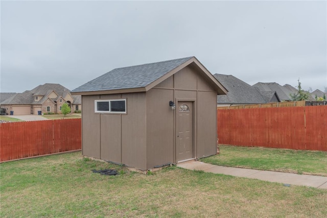 view of shed featuring a fenced backyard