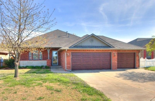 8800 NW 71st St, Oklahoma City, OK 73132 - ranch-style house featuring driveway, an attached garage, brick siding, a front lawn, and a shingled roof