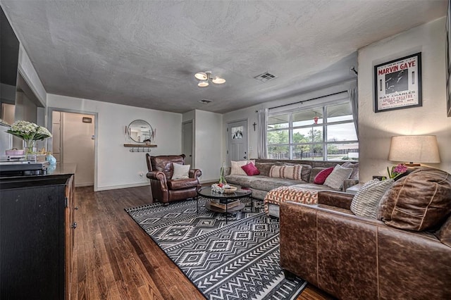2837 Cambridge Ct, Oklahoma City, OK 73116 - living area with baseboards, visible vents, wood finished floors, and a textured ceiling