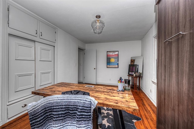 2837 Cambridge Ct, Oklahoma City, OK 73116 - bedroom with baseboards and dark wood-style flooring