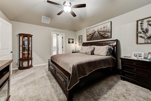 5513 Carmel Creek Dr, Mustang, OK 73064 - bedroom with light colored carpet, baseboards, a ceiling fan, and ensuite bath