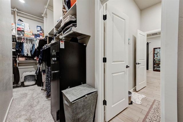 5513 Carmel Creek Dr, Mustang, OK 73064 - spacious closet featuring light wood-style flooring