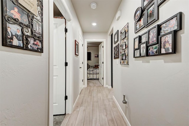 5513 Carmel Creek Dr, Mustang, OK 73064 - corridor featuring light wood-style flooring, baseboards, and recessed lighting