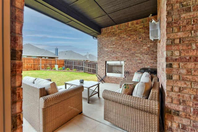 5513 Carmel Creek Dr, Mustang, OK 73064 - view of patio / terrace with an outdoor living space with a fireplace
