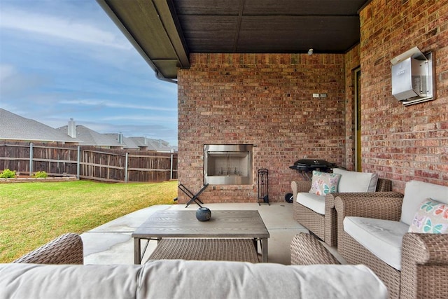5513 Carmel Creek Dr, Mustang, OK 73064 - view of patio with an outdoor living space with a fireplace and a wall mounted air conditioner