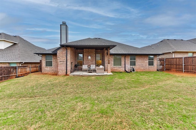 5513 Carmel Creek Dr, Mustang, OK 73064 - rear view of house with an outdoor living space, a patio area, brick siding, and roof with shingles