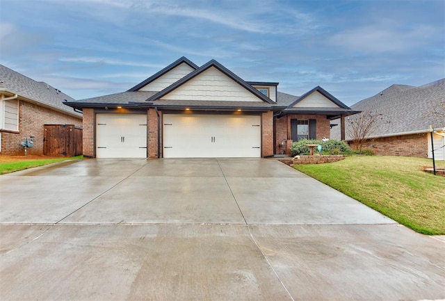 5513 Carmel Creek Dr, Mustang, OK 73064 - single story home featuring a garage, concrete driveway, a front yard, and brick siding