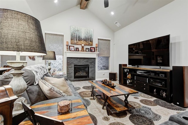 5513 Carmel Creek Dr, Mustang, OK 73064 - living area with ceiling fan, a stone fireplace, beamed ceiling, high vaulted ceiling, and recessed lighting
