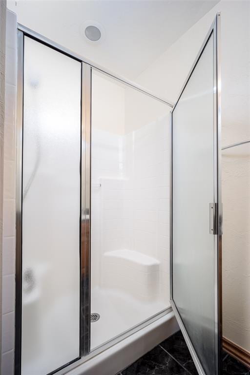 bathroom with a stall shower