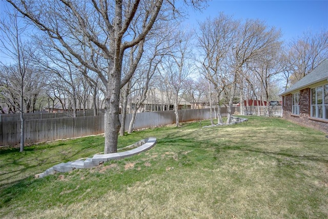 view of yard featuring a fenced backyard