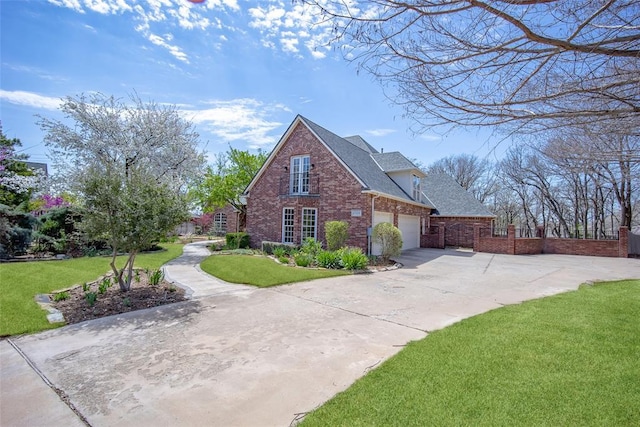 2500 Portofino Pl, Edmond, OK 73034 - view of property exterior featuring brick siding, driveway, roof with shingles, and an attached garage