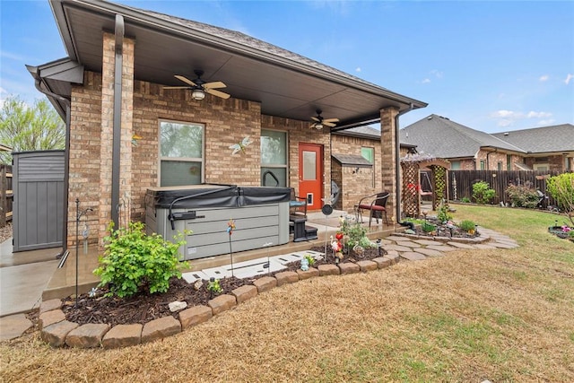 11609 SW 14th St, Yukon, OK 73099 - back of house featuring a hot tub, ceiling fan, and a patio