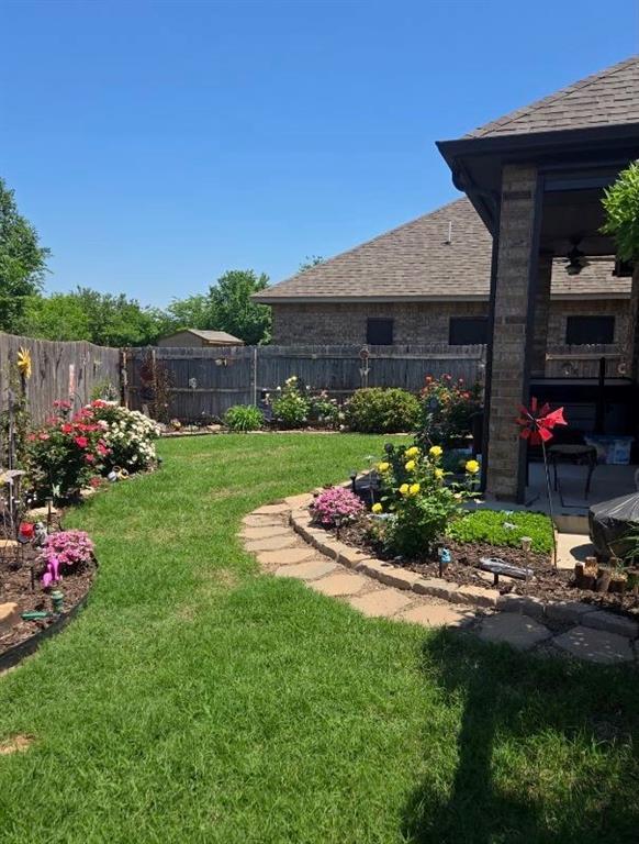 11609 SW 14th St, Yukon, OK 73099 - view of yard with ceiling fan and a patio