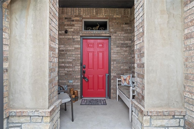 11609 SW 14th St, Yukon, OK 73099 - doorway to property with brick siding and a porch