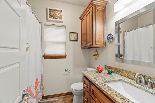 11609 SW 14th St, Yukon, OK 73099 - bathroom with toilet, vanity, and baseboards