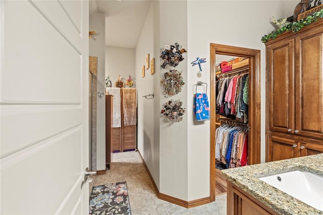 11609 SW 14th St, Yukon, OK 73099 - corridor featuring a sink and baseboards