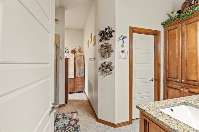 11609 SW 14th St, Yukon, OK 73099 - corridor featuring baseboards and a sink