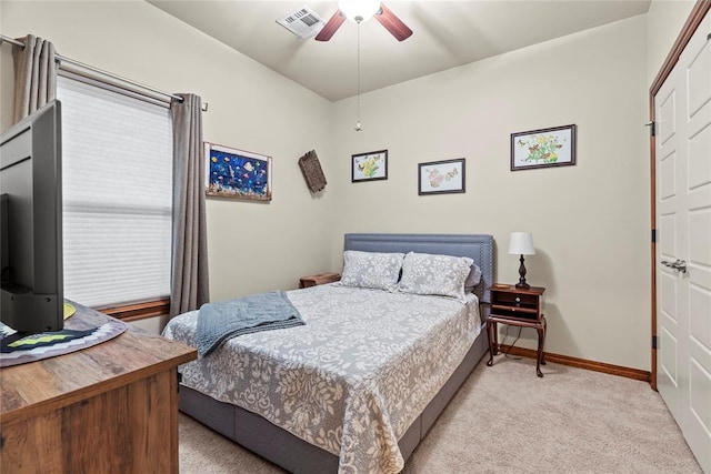 11609 SW 14th St, Yukon, OK 73099 - carpeted bedroom featuring baseboards and a ceiling fan
