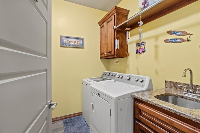 11609 SW 14th St, Yukon, OK 73099 - laundry room with washer and clothes dryer, cabinet space, and baseboards