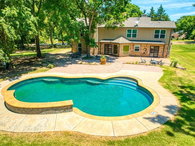 44303 Hardesty Rd, Shawnee, OK 74801 - outdoor pool with a patio and a lawn