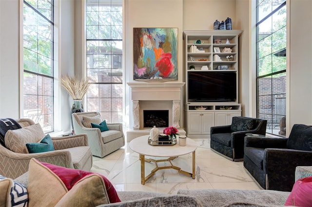 6206 Waterford Blvd Unit 79, Oklahoma City, OK 73118 - living area with a fireplace with raised hearth and marble finish floor