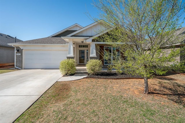 craftsman-style home with driveway, a garage, and a front lawn