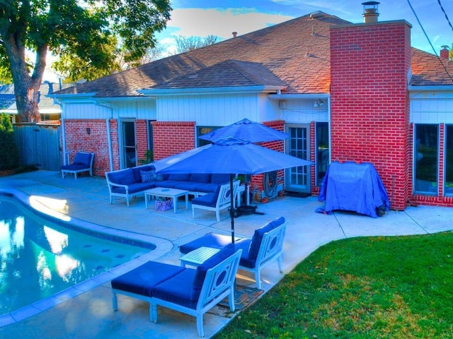 1821 Coventry Ln, Nichols Hills, OK 73120 - rear view of house with an outdoor hangout area, brick siding, a patio, and roof with shingles