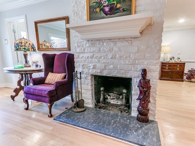 1821 Coventry Ln, Nichols Hills, OK 73120 - sitting room featuring ornamental molding, wood finished floors, and a fireplace with raised hearth