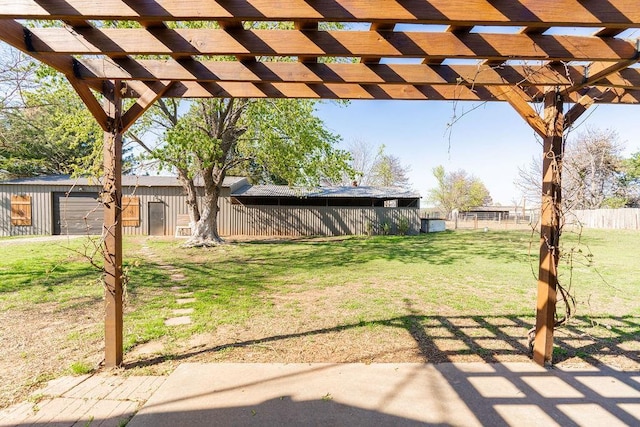 view of yard with a pergola and fence
