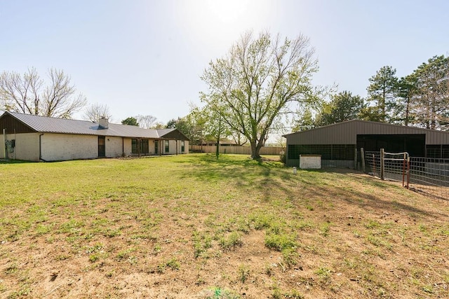 view of yard with an exterior structure and an outdoor structure