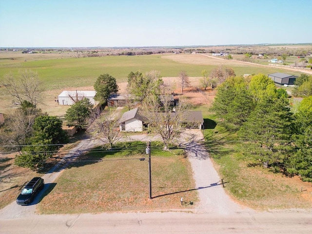 birds eye view of property with a rural view