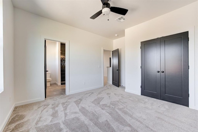 2223 Wintercreek Blvd, Blanchard, OK 73010 - unfurnished bedroom with carpet flooring, a closet, connected bathroom, and ceiling fan