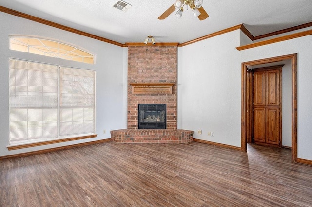 unfurnished living room with wood finished floors, ornamental molding, a ceiling fan, and visible vents