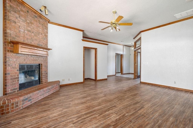 unfurnished living room featuring a textured ceiling, wood finished floors, ceiling fan, and baseboards