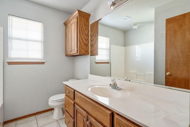 bathroom featuring visible vents, a bathing tub, toilet, vanity, and tile patterned flooring