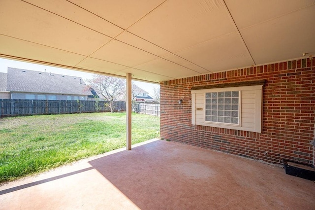 view of patio featuring fence