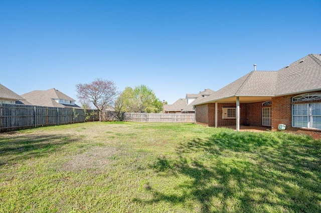 view of yard featuring a fenced backyard