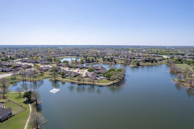 drone / aerial view with a water view and a residential view