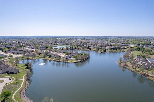 birds eye view of property with a water view and a residential view