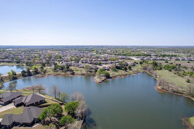 birds eye view of property with a water view and a residential view