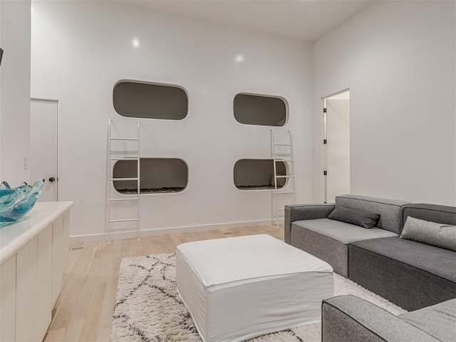 living room featuring light wood-style floors and baseboards
