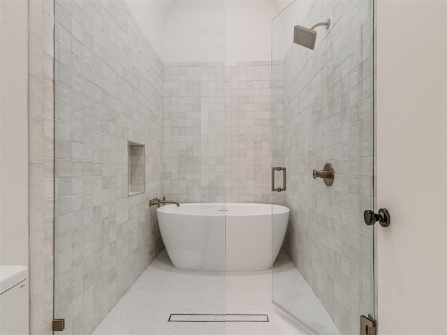bathroom featuring a soaking tub, tile patterned floors, a stall shower, and tile walls