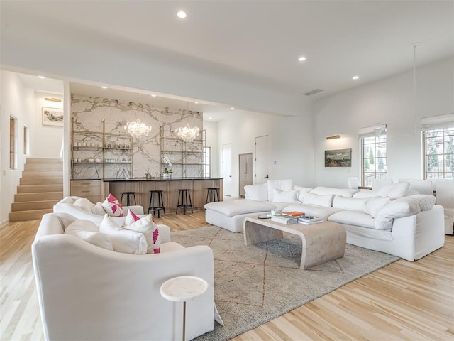living area featuring recessed lighting, visible vents, and light wood-style flooring