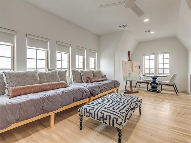 living area with light wood-style floors, visible vents, a ceiling fan, and baseboards