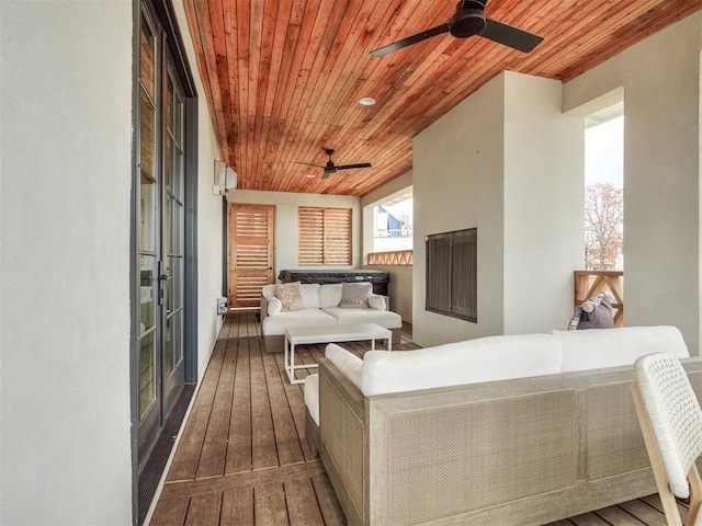 exterior space featuring wood ceiling, hardwood / wood-style flooring, and a ceiling fan