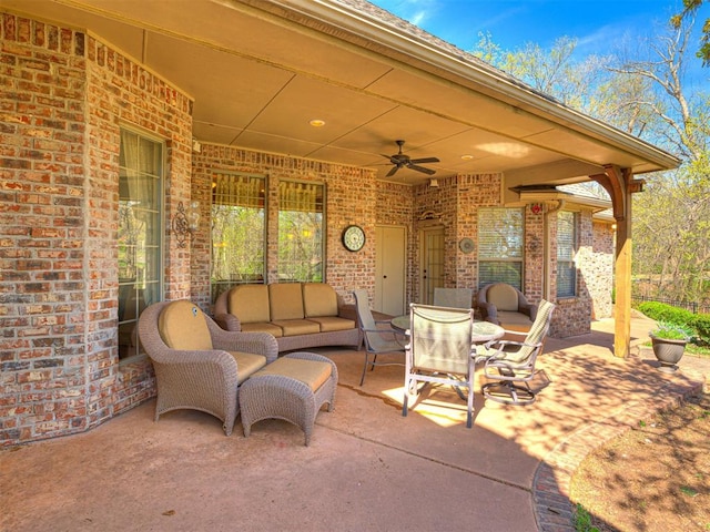 view of patio featuring an outdoor living space, ceiling fan, and outdoor dining area