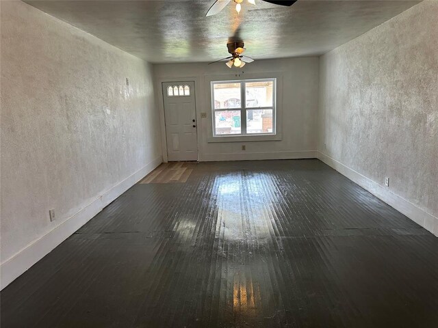 314 N Maryland Ave, Mangum, OK 73554 - entrance foyer featuring baseboards, a ceiling fan, and hardwood / wood-style floors