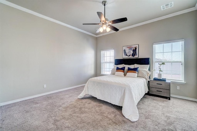 bedroom featuring baseboards, ornamental molding, carpet flooring, visible vents, and multiple windows