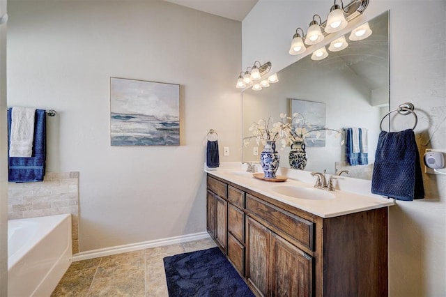 bathroom featuring a sink, baseboards, double vanity, and a garden tub