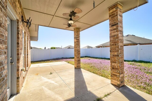 view of patio / terrace with a fenced backyard and ceiling fan